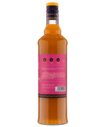 Rear view of a golden liquor bottle displaying detailed product information on a pink label.