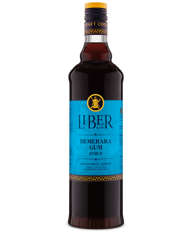 Front view of a dark brown bottle with a vibrant blue label and a yellow emblem, against a white background. Hover Image
