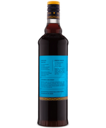 Rear view of a dark brown bottle displaying a blue label with detailed text, set against a white background.