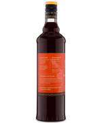 Side view of a glass bottle with a red label and dark liquid, perfect for blood orange beverages.