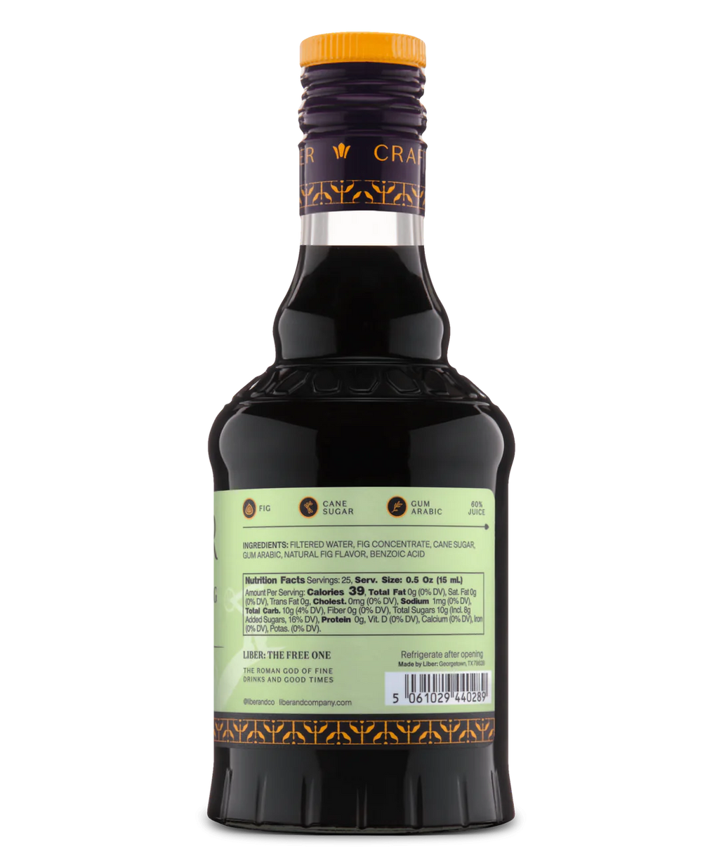 Back view of a glass bottle with pale green label and dark liquid, ideal for cocktails or desserts.