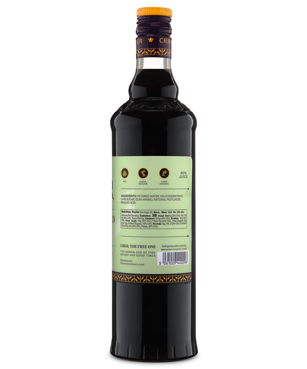 Side view of a tall glass bottle with pale green label and dark liquid, suitable for gourmet beverages.